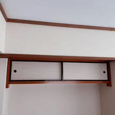 a wooden shelf with white blinds on a wall at Shiki no Sai Asakusa in Tokyo