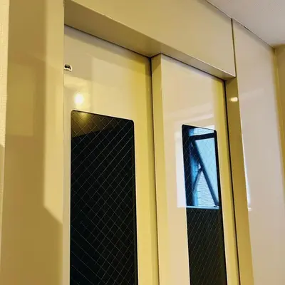 a glass door with a mirror on a wall at Shiki no Sai Asakusa in Tokyo