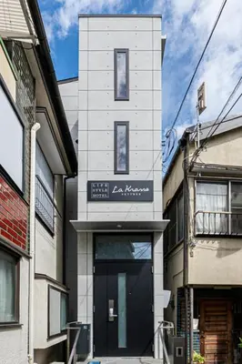 a building with a sign on the side of it at La Krasse Skytree - Vacation STAY 12839 in Tokyo