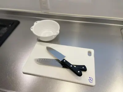 a knife on a cutting board on a counter at Senjyu House in Tokyo