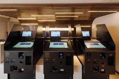 three atm machines are lined up in a room at JR-East Hotel Mets Shibuya in Tokyo