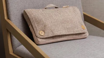 a purse sitting on top of a chair at JR East Hotel Mets Premier Akihabara in Tokyo