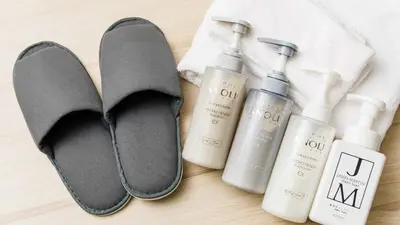 a pair of flip flops next to a pair of products at JR East Hotel Mets Premier Gotanda in Tokyo