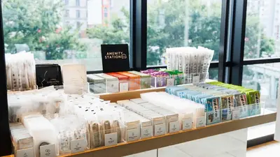 a store shelf filled with lots of products on display at JR East Hotel Mets Premier Gotanda in Tokyo