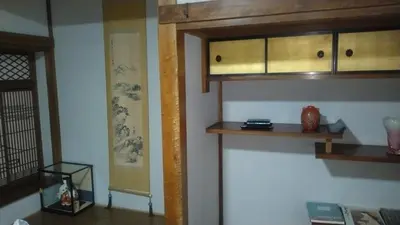 a kitchen with wooden cabinets in a room at \u30ec\u30f3\u30bf\u30eb\u30eb\u30fc\u30e0\u76ee\u9ed2 in Tokyo