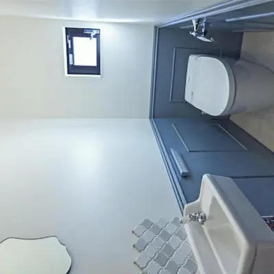 a small bathroom with a toilet and a sink at \u30ec\u30f3\u30bf\u30eb\u30eb\u30fc\u30e0\u76ee\u9ed2 in Tokyo