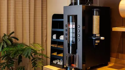 a wine dispenser next to a bottle of wine at JR-East Hotel Mets Koenji in Tokyo