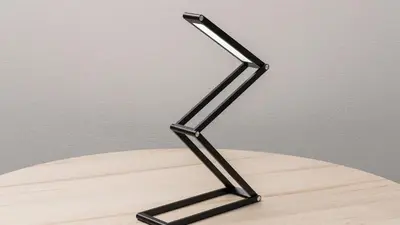 a black metal stand sitting on top of a wooden table at JR East Hotel Mets Premier Tokyo Bay Shinkiba in Tokyo
