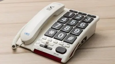 a remote control sitting on top of a wooden table at JR-East Hotel Mets Omori in Tokyo