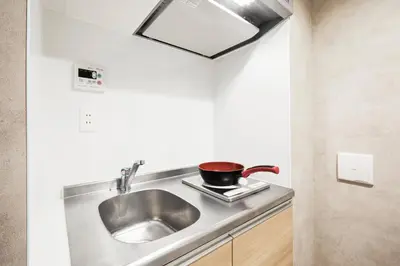 a kitchen with a sink and a pot on a stove at Designed apart ment Yamanote Line Shin-Okubo Sta 3 min walk in Tokyo