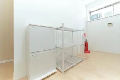 a white refrigerator in a room with a floor at Minami-Shinagawa House by Tranova in Tokyo