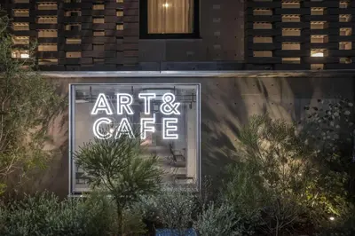 a sign that says art and care on a wall at Spatium Ginza Pony in Tokyo