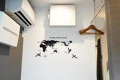 a map of the world on a wall in a room at Hostel LodgingToyko Minowa in Tokyo