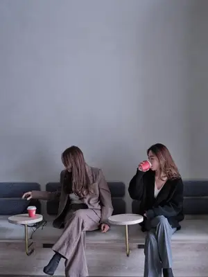 two women sitting on a couch drinking from a cup at fav TOKYO NISHINIPPORI in Tokyo