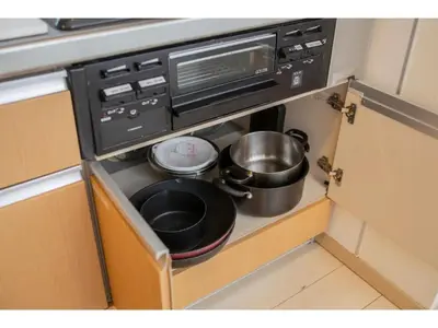 a kitchen with a microwave and pots and pans at Forest House - Vacation STAY 44322v in Tokyo