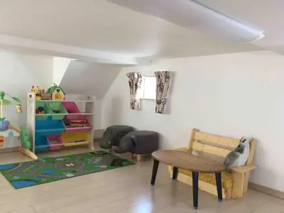 a room with a chair and a table and a window at Forest House - Vacation STAY 44322v in Tokyo
