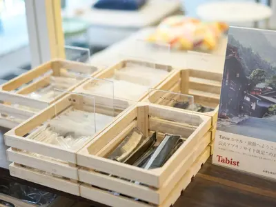 a wooden box with dividers on a table at Tabist Ginza in Tokyo
