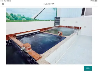 a large pool of water in a building at Asahiyuplus in Tokyo