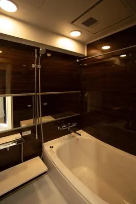 a bathroom with a bath tub and a shower at LUCKY house43 in Tokyo