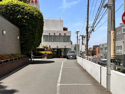 a car is driving down a street on a bridge at LUCKY house43 in Tokyo