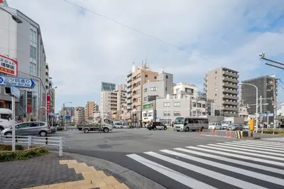 a busy city street with cars and buildings at \u30d1\u30fc\u30af\u30a2\u30af\u30b7\u30b9\u672c\u6240\u543e\u59bb\u6a4b\u30b5\u30a6\u30b9\u30ec\u30b8\u30c7\u30f3\u30b9 in Tokyo