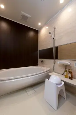 a bathroom with a tub and a toilet and a sink at \uff25\uff2e\uff34 \uff34\uff25\uff32\uff32\uff21\uff23\uff25 \uff21\uff33\uff21\uff2b\uff35\uff33\uff21 - Vacation STAY 85544v in Tokyo