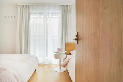 a bedroom with two beds and a window at Designer's Villa in Shinjuku-ku Shin-Okubo sta 6 min walk F in Tokyo