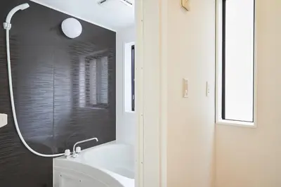 a bathroom with a shower and a white sink at Designer's Villa in Shinjuku-ku Shin-Okubo sta 6 min walk F in Tokyo