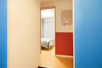 a hallway with a door leading to a bedroom at Designer's Villa in Shinjuku-ku Shin-Okubo sta 6 min walk F in Tokyo