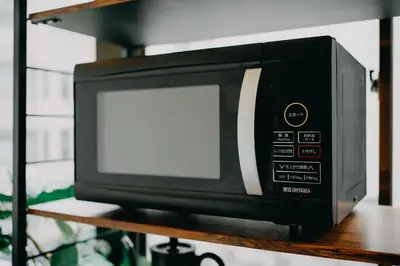 a microwave oven sitting on top of a shelf at unito light SHIMBASHI in Tokyo