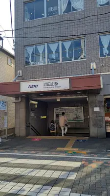 a person is standing outside of a building at Homestay Intimo Amigo in Tokyo