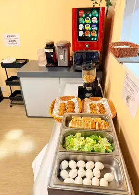 a counter with eggs and lettuce and bread and food at Ano Hotel Asakusa in Tokyo
