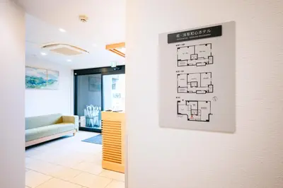 a wall with a floor plan on a wall at \u82e5\u6d45\u8349\u548c\u5fc3\u30db\u30c6\u30eb in Tokyo