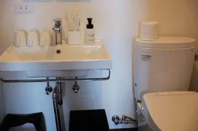 a bathroom with a sink and a toilet at \u82e5\u6d45\u8349\u548c\u5fc3\u30db\u30c6\u30eb in Tokyo