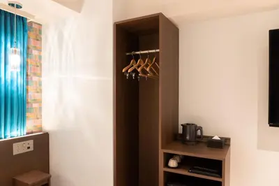 a cupboard with utensils in it in a room at karaksa hotel colors Tokyo Yaesu in Tokyo