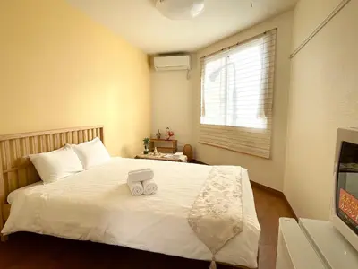 a bedroom with a bed with two towels on it at Ustay Kitakoiwa in Tokyo