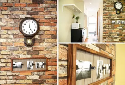 a brick wall with a clock on it at Ustay Kitakoiwa in Tokyo