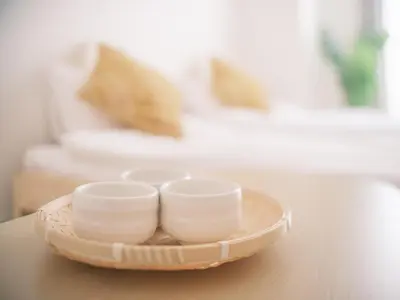 three white cups on a tray on a table at Ustay ueno in Tokyo