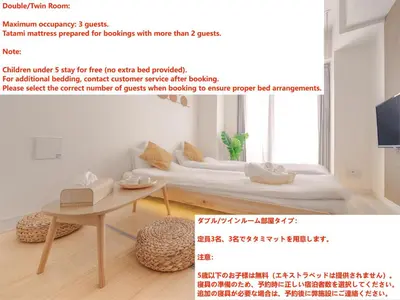 a room with a bed and a table at Ustay ueno in Tokyo