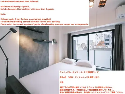 a room with a bed and a large window at Ustay ueno in Tokyo