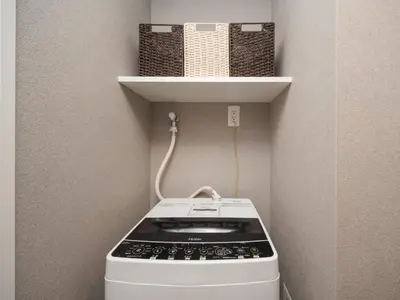 a small stove in a corner of a room at Ustay ueno in Tokyo