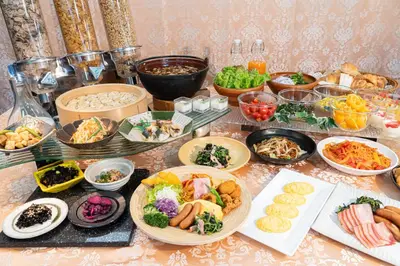 a table with many plates of food on it at L stay & grow Harumi in Tokyo