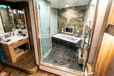 a bathroom with a shower and a sink at Hotel Bali An Resort Shinjuku Forest in Tokyo