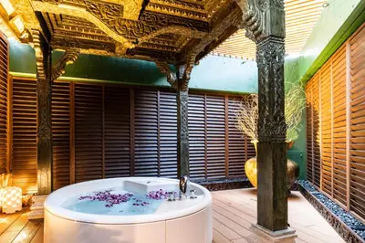 a bath tub in a room with a ceiling at Hotel Bali An Resort Shinjuku Forest in Tokyo