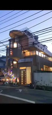 a large building with a staircase on top of it at \u90fd\u5fc3\u306e\u5bb630 square meter king size bed, step meter, 3-person room201 in Tokyo