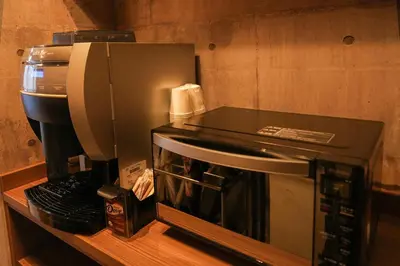 a microwave sitting on a counter next to a coffee maker at N Plus Hotel Akihabara in Tokyo