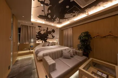 a bedroom with a bed and a couch in it at HOTEL\u307f\u306a\u3068-MINATO- in Tokyo