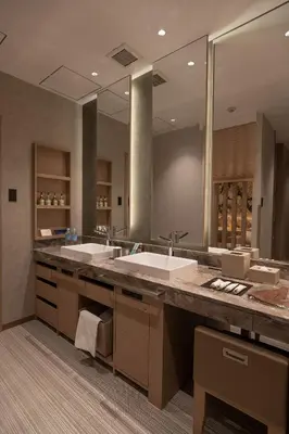 a bathroom with two sinks and a large mirror at HOTEL\u307f\u306a\u3068-MINATO- in Tokyo