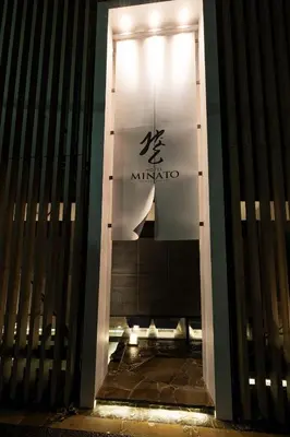 a door to a building with a sign on it at HOTEL\u307f\u306a\u3068-MINATO- in Tokyo