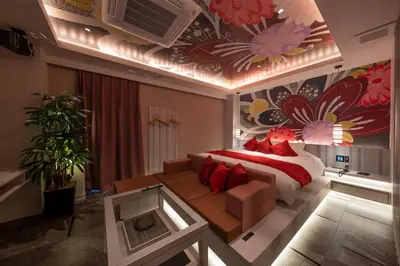 a bedroom with a bed and a flower mural on the ceiling at HOTEL\u307f\u306a\u3068-MINATO- in Tokyo